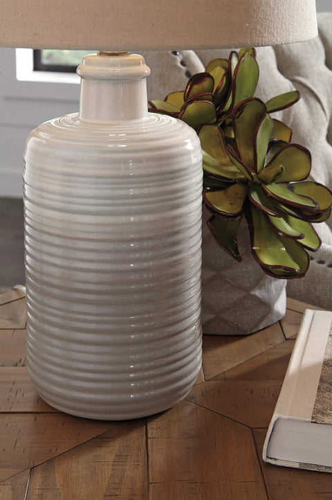 Two Pack Neutral Ceramic Table Lamps, 25.5 Inch Tall with Taupe Glazed Bases and Textured Drum Shade on wooden table