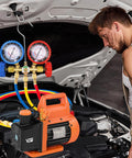 Front view of VTG VOGTEN 4.5 CFM AC vacuum pump with dual gauges and hoses; orange pump with blue and red gauges under hood.