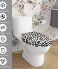 Elongated Resin Toilet Seat for Bathroom featuring a unique black and white spotted design on a white toilet.
