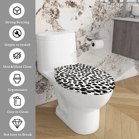 Elongated Resin Toilet Seat for Bathroom featuring a unique black and white spotted design on a white toilet.