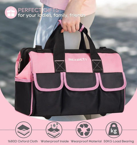 Woman holding a pink and black 16-inch tool bag from Pink 219-Piece Tool Set For Women With 16 Inch Tool Bag, with durable straps.