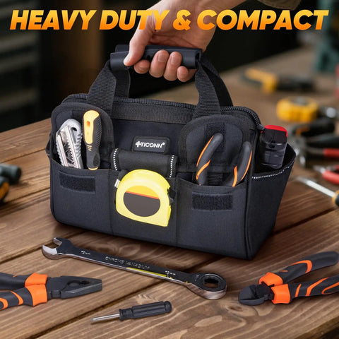Heavy Duty Tool Bag with multi pocket for pros, built from 600D Oxford fabric, on workbench with tools, 12 inch base, black