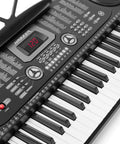 Close-up of a 61 Key Portable Keyboard Piano Kit With Stand, Built-In Speakers, Microphone, And Learning System For Beginners, showing control panel.