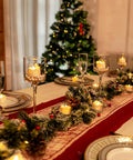 Festive dining table with 12 Pack Flameless Tea Lights With Timer Auto On For 6 Hours, Off 18 Hours Everyday, elegant holiday decor.