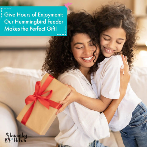 Mother and daughter embrace while holding a gift box with ribbon, promoting a hummingbird feeder as the perfect gift.