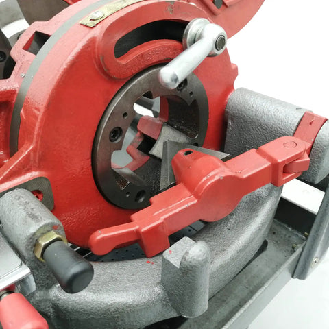 Close-up of Built Tough Electric Pipe Threader Machine for 1/2 to 3 Inch Steel Tubing auto die head and cleaning components.