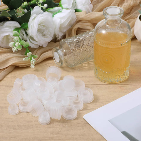 60 Pcs Salt And Pepper Stoppers Plugs Set In Six Sizes 10mm 13mm 15mm 18mm 20mm 23mm Plastic Reusable Round End Caps next to bottle