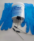 Marine Grade Anti-Corrosion And Anti-Seize Lubricant In A 16oz Bottle with brushes and gloves for sailboat rigging and hardware.