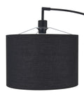 Close-up of the black fabric shade on tall 71 inch arc floor lamp with steel base, modern standing light for living room over couch