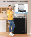 Woman using Ultra Quiet 5.0 Cu Ft Deep Freezer With Compact Design For Home And Small Shops in kitchen setting.