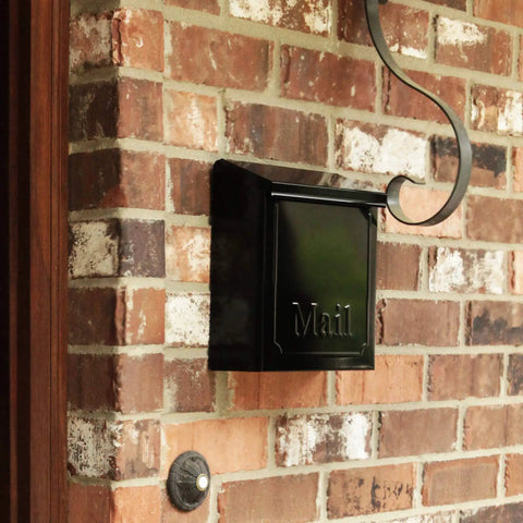 Black Townhouse Wall Mount Mailbox With Hidden Locking Compartment And Two Keys Rust Resistant Galvanized Steel on brick wall.