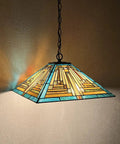 Green 16 Inch Tiffany Style Pendant Light Fixture With Two Lights, Mission stained glass shade lit, hanging from the ceiling
