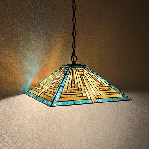 Green 16 Inch Tiffany Style Pendant Light Fixture With Two Lights, Mission stained glass shade lit, hanging from the ceiling