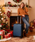 Your Go To Carry On Luggage For Airport Runs With Durable Hardside Shell, Airline Approved, Royal Blue near fireplace and holiday decor