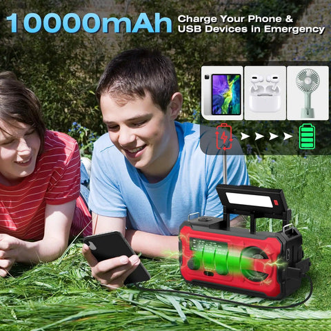 Teens using Emergency Radio With NOAA Weather Radio And AM FM Bands 10000mAh Power Bank USB Solar And Hand Crank Charging in park.