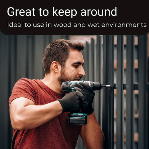 Person using power drill on outdoor fence, demonstrating Heavy Duty Five Eighth Inch Stainless Flat Washer Pack Of 100, Built To Take A Beating And Last, One And A Half Inch Outer Diameter, 304 Stainless Steel, Corrosion Resistant, Ideal For Factory Repairs, Kitchens, Shops, And Outdoor Construction
