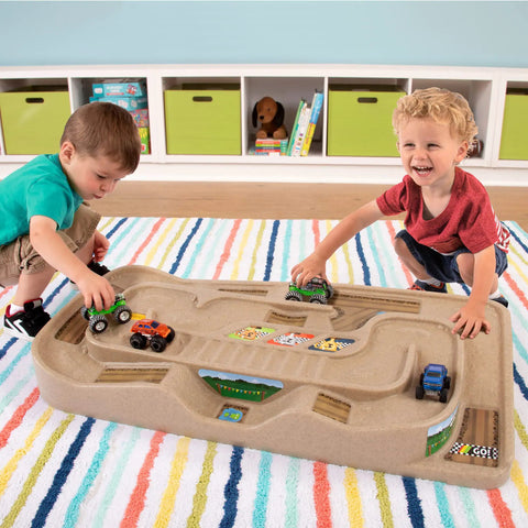 Children playing with On The Go Kid Friendly Race Track Table With 2-Sided Play Surface For Cars And Trains, Portable No Assembly Toy Table For Ages 3 4 5 6 7, Made In USA, Great For Playrooms And Living Rooms