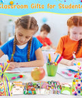Children using All In One Stationery Party Pack For Kids With 24 Goodie Bags Mini Notebooks Multicolor Pens Slap Bracelets