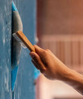 Hand using Best Ever Climbing Brush For Chalk And Bouldering Vegan Chalk Bag Friendly Rock Climbing Brush Ultra Efficient Chalk Remover
