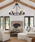 Industrial Black Wagon Wheel Chandelier With Six Candle Style Lights Dope Farmhouse Vibe Ceiling Fixture in modern living room