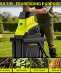 Man using Electric Wood Chipper Shredder With Fifteen Amp Motor And One Point Eight Inch Cutting Diameter Portable Wheels