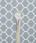 Close-up of zipper and umbrella hole on Grey Moroccan round outdoor tablecloth with elastic edge, 1.8 inch diameter visible.