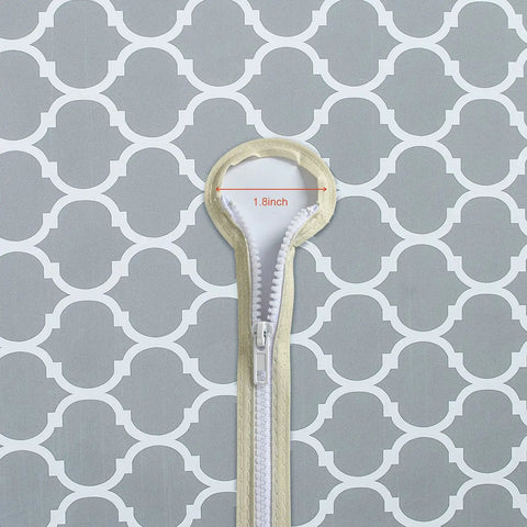 Close-up of zipper and umbrella hole on Grey Moroccan round outdoor tablecloth with elastic edge, 1.8 inch diameter visible.