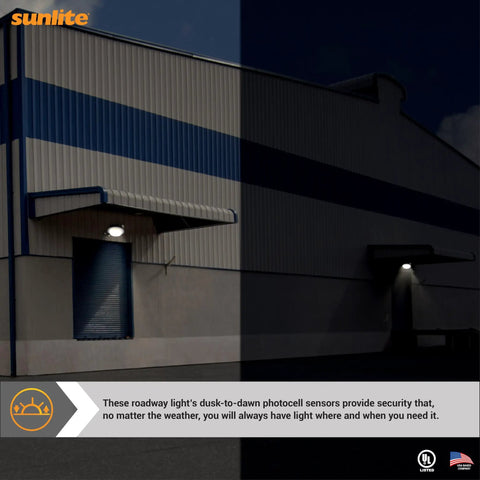 Warehouse exterior with LED Roadway Security Light With Dusk To Dawn Sensor, Wall Or Pole Mount, illuminated at night.