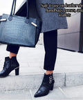 Woman holding handbag and wearing boots, illustrating use of Travel Lite Pre Moistened Shoe Shine Wipes Pack Of 50 Individually Wrapped Streak Free Leather Cleaning Wipes On The Go For Instant Shine And Spotless Finish.