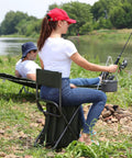 Woman fishing on Backpack Cooler Chair With Backrest, Folding Camping Stool For Outdoors, Insulated Cooler Bag visible