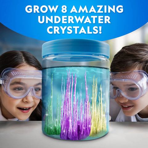 Two children excitedly observing colorful crystals in a 360-degree canister, Underwater Crystal Growing Science Kit For Kids Grow 8 Colorful Crystals In A 360 Degree Viewing Canister Safe Easy Hands On Aquarium Experiment Perfect STEM Activity For Curious Kids And Families.