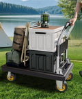 Blue Platform Hand Truck With Five Inch Wheels Heavy Duty Utility Cart And Moving Dolly For Smooth Hauling Of Construction Gear And Luggage Zero Sweat Guaranteed with gear on grass.