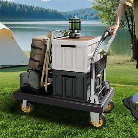 Blue Platform Hand Truck With Five Inch Wheels Heavy Duty Utility Cart And Moving Dolly For Smooth Hauling Of Construction Gear And Luggage Zero Sweat Guaranteed with gear on grass.