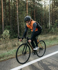 Cyclist on a road bike with Two Pack 700C Road Bike Tires And Heavy Duty Tubes With Presta Valve For 700X25C To 700X26C.