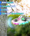 UFO Drone For Kids With Colorful LED Lights flying near tree, showcasing anti-impact foam build and safe design for beginners.
