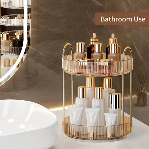 Kick Back And Organize Your Vanity Game With This Smooth Spin 360 Rotating Makeup Organizer Featuring Two Tier High Capacity Storage For Cosmetics Skincare And Perfume In Classic Amber Gold placed in a bathroom.