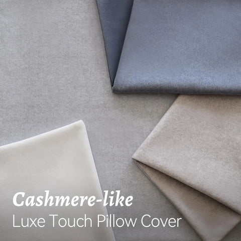 Various shades of cashmere-like luxe touch pillow covers folded, showcasing texture and softness.