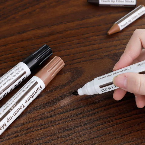 No Sweat Scratch Fix Kit 18 Color Wood Markers Plus Fillers For Furniture Laminate Hardwood Floors Cabinets Doors Quick Stain Match being used on scratch.