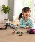 Child playing with CASE SV340B Skid Steer Loader Toy Set With Flatbed Trailer RAM Pickup Horse Trailer And Two Horses.