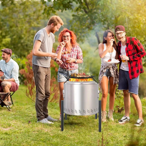 Sturdy Stainless Fire Pit Stand 15 To 27 Inches For Most Outdoor Fire Pits And Camping Stoves Heavy Duty Fire Pit Accessory Elevates Fire Pit Safely Off Ground Silver with group of friends enjoying BBQ.