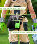 Person wearing Five-Pocket Garden Tool Belt With Adjustable Go-To Waist Strap For Women, holding garden tools.
