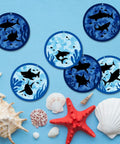 24 Pack Summer Shark Crafts Kit With Tissue Paper Suncatchers for Ocean Theme DIY Decor featuring sea animal suncatchers on blue background