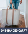 Woman carrying Grab And Go Collapsible Laundry Caddy Tote With Handles, XXL 64L Pop Up Laundry Basket in Luxe Cream Herringbone