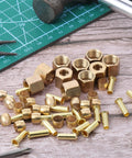 Close-up of brass 1/4-inch compression fittings with nuts, ferrules and sleeves (assortment kit)