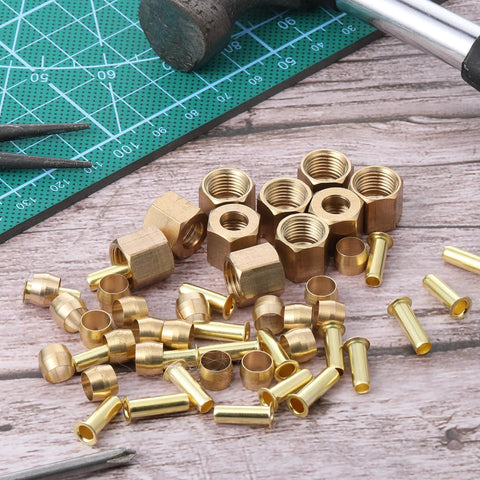 Close-up of brass 1/4-inch compression fittings with nuts, ferrules and sleeves (assortment kit)