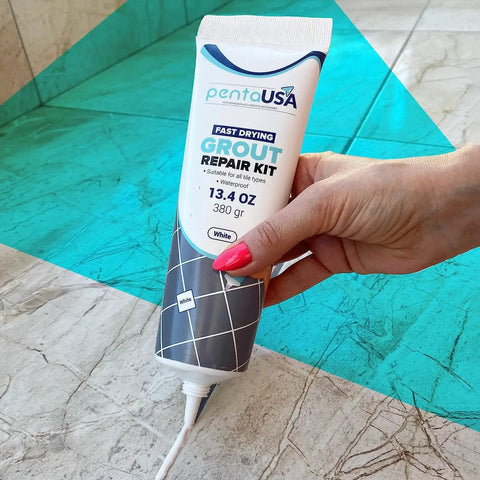 Hand holding White Premixed Acrylic Sanded Grout Repair Kit With Applicator, Water Resistant Grout Filler, 13.4 oz tube