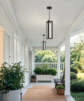 Heavy Duty Black Aluminum Led Outdoor Pendant Light 20 Inch Linear Chandelier illuminating a porch with greenery and seating.