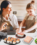Mother and child using Musubi Press Mold Kit 2 Pack Clear Musubi Maker With Stainless Steel 304 Slicer in kitchen.