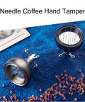 Pro Level 58mm Coffee Powder Distributor And Espresso Stirrer Tool Featuring Adjustable Height Dial Built From Food Grade Metal For Smooth Barista Extraction Plus Even Ground Bedding In Dope Gloss Black on blue background.