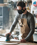 Man woodworking wearing Dust Mask With Carbon Filters And Air Valves, Reusable Three Size Fit For Woodworking, Construction And Moving, Black Large